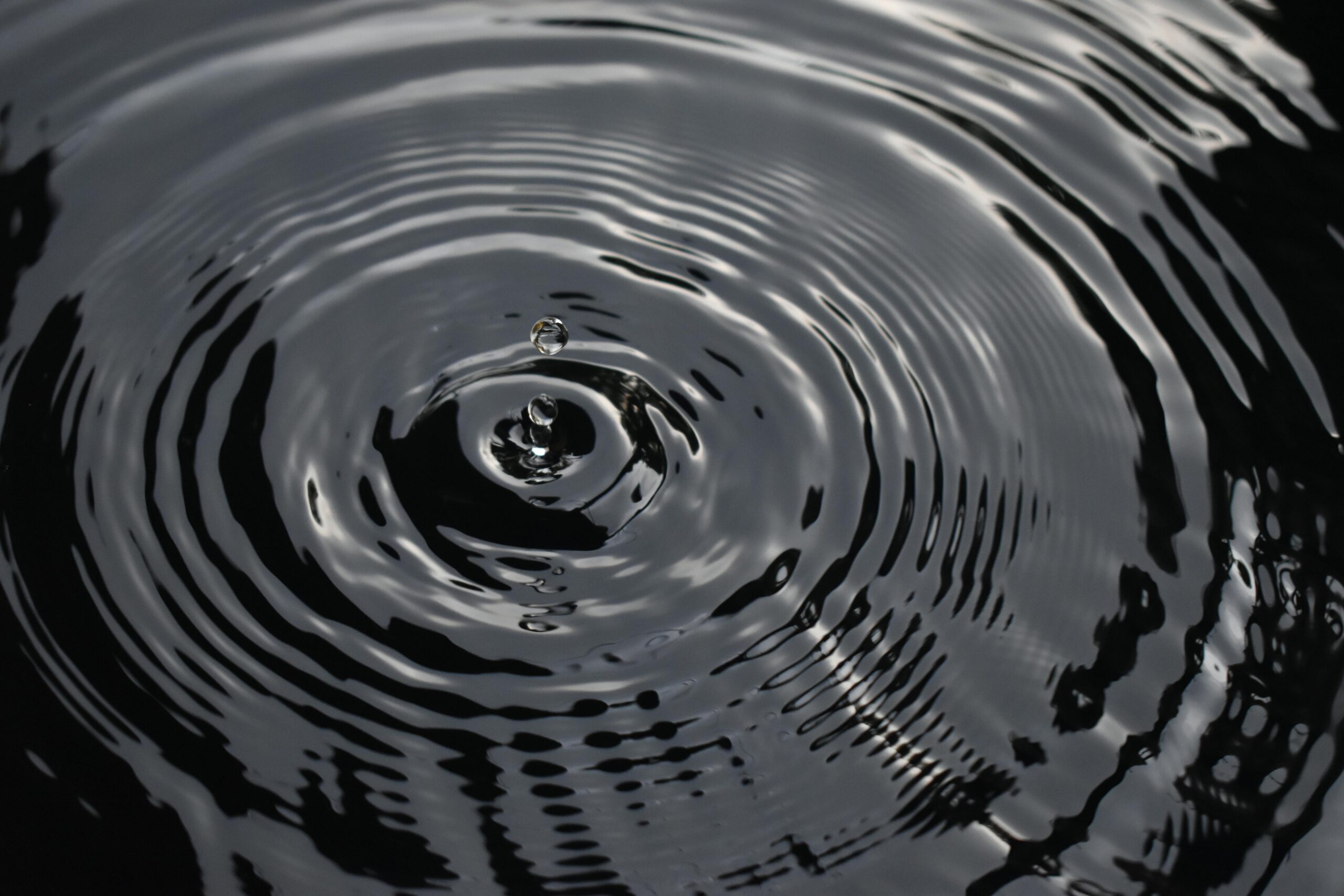 black and white image with ripples of water representing emotional suppression 