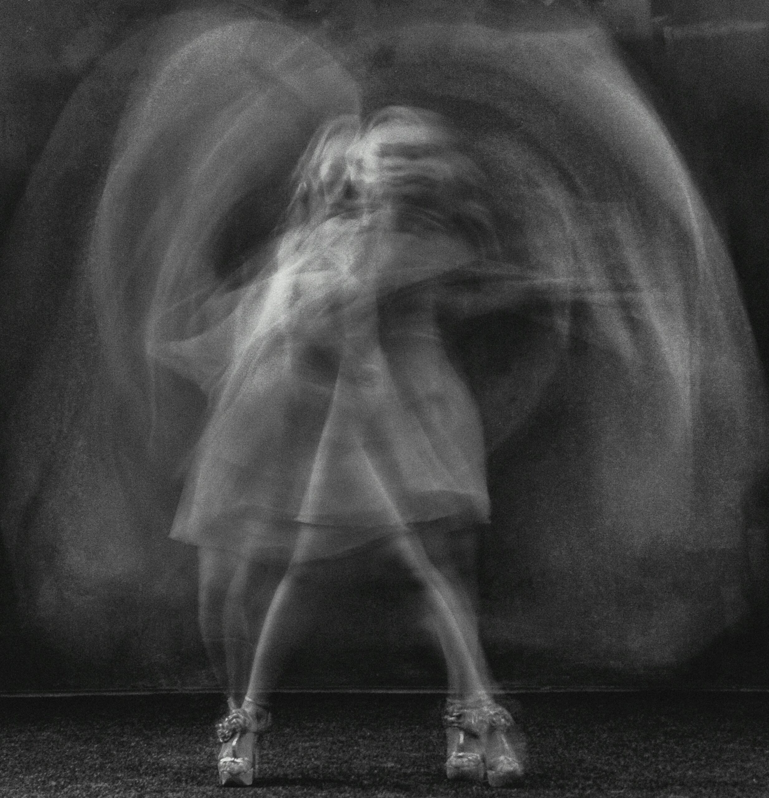 woman blurred in movement in black and white representing soul disconnection